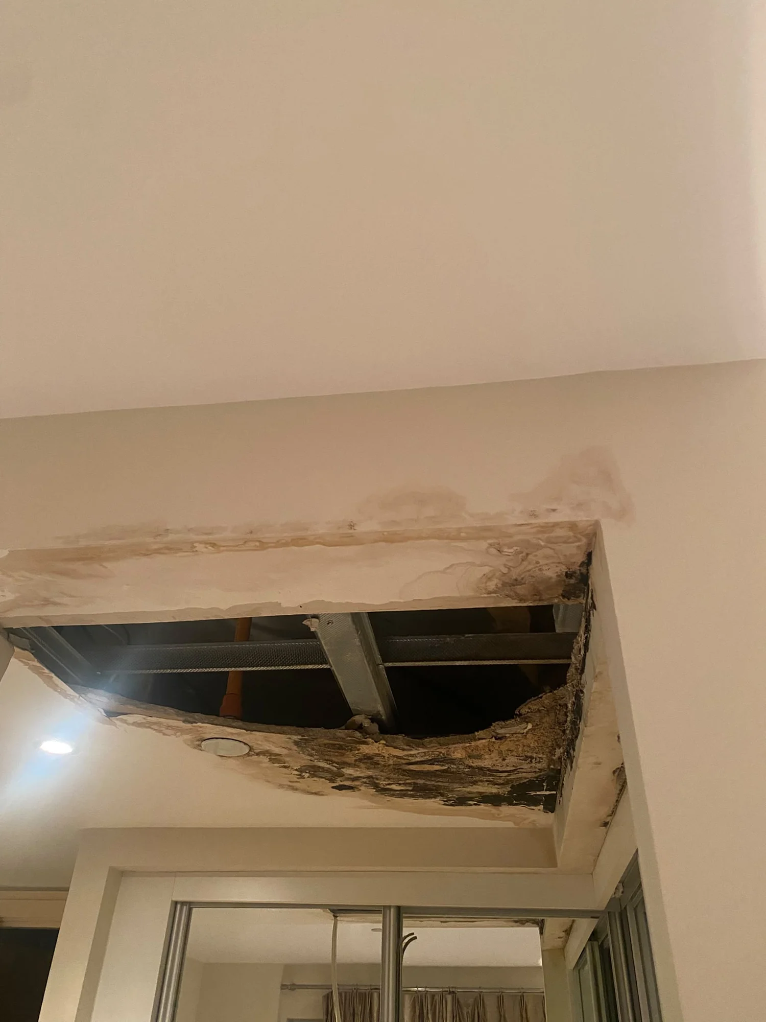 Damaged ceiling before repairs